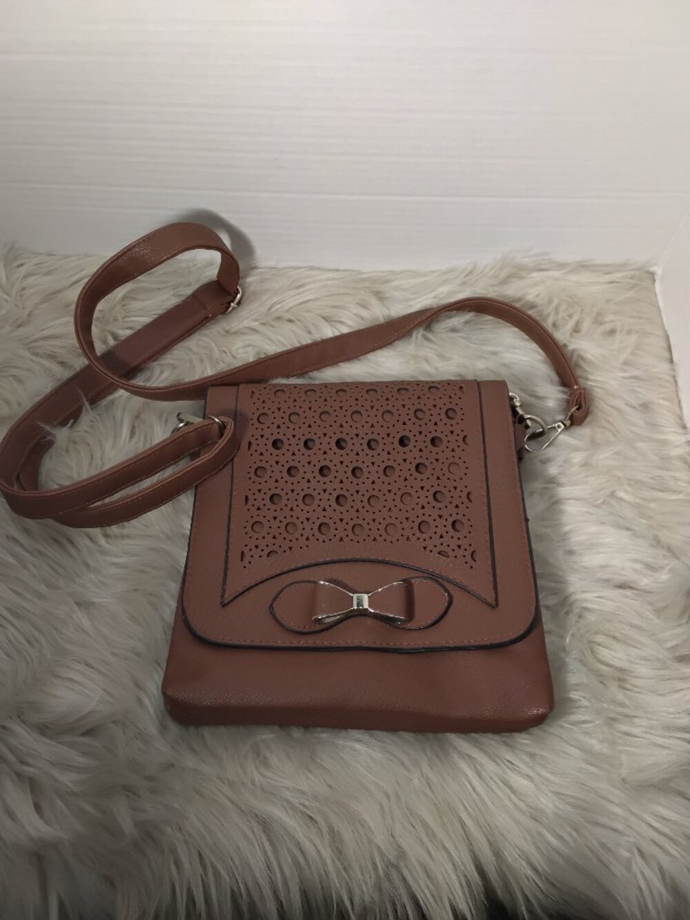 Brown Leather Handbag – Perforated Front & Bow Accent
